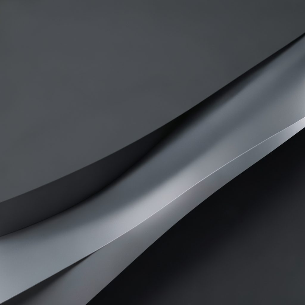 Muted charcoal and silver layered shapes with a cinematic wide aspect feel